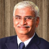 Mr Dharmakrishnan FCA, CEO